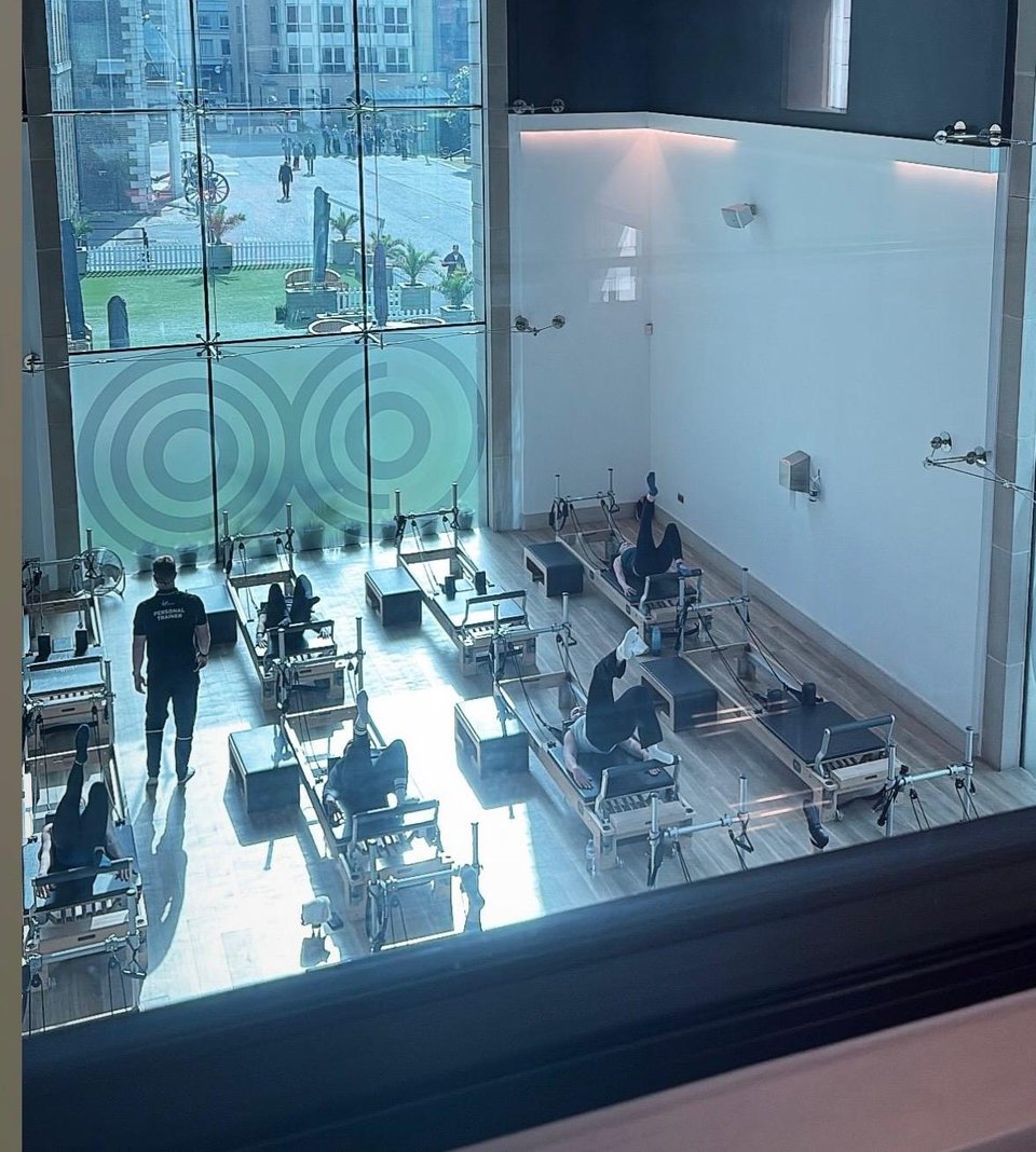 Overhead view of a large London gym floor through glass