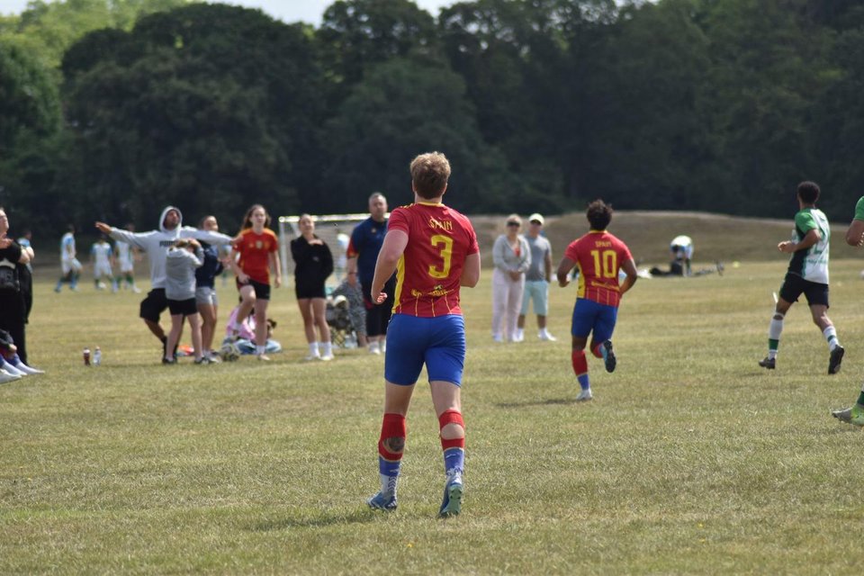 Outdoor football training session on a grass pitch
